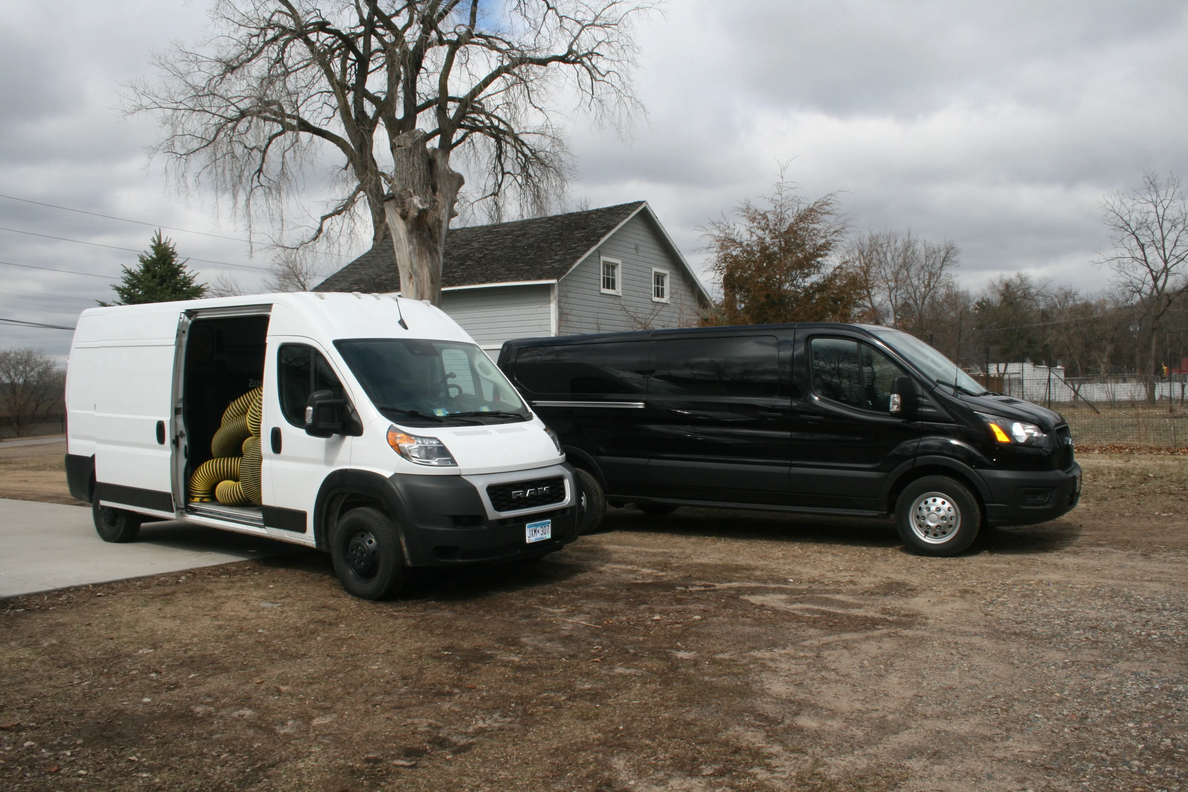 AB CAM Services fleet vans ready for residential and commercial jobs