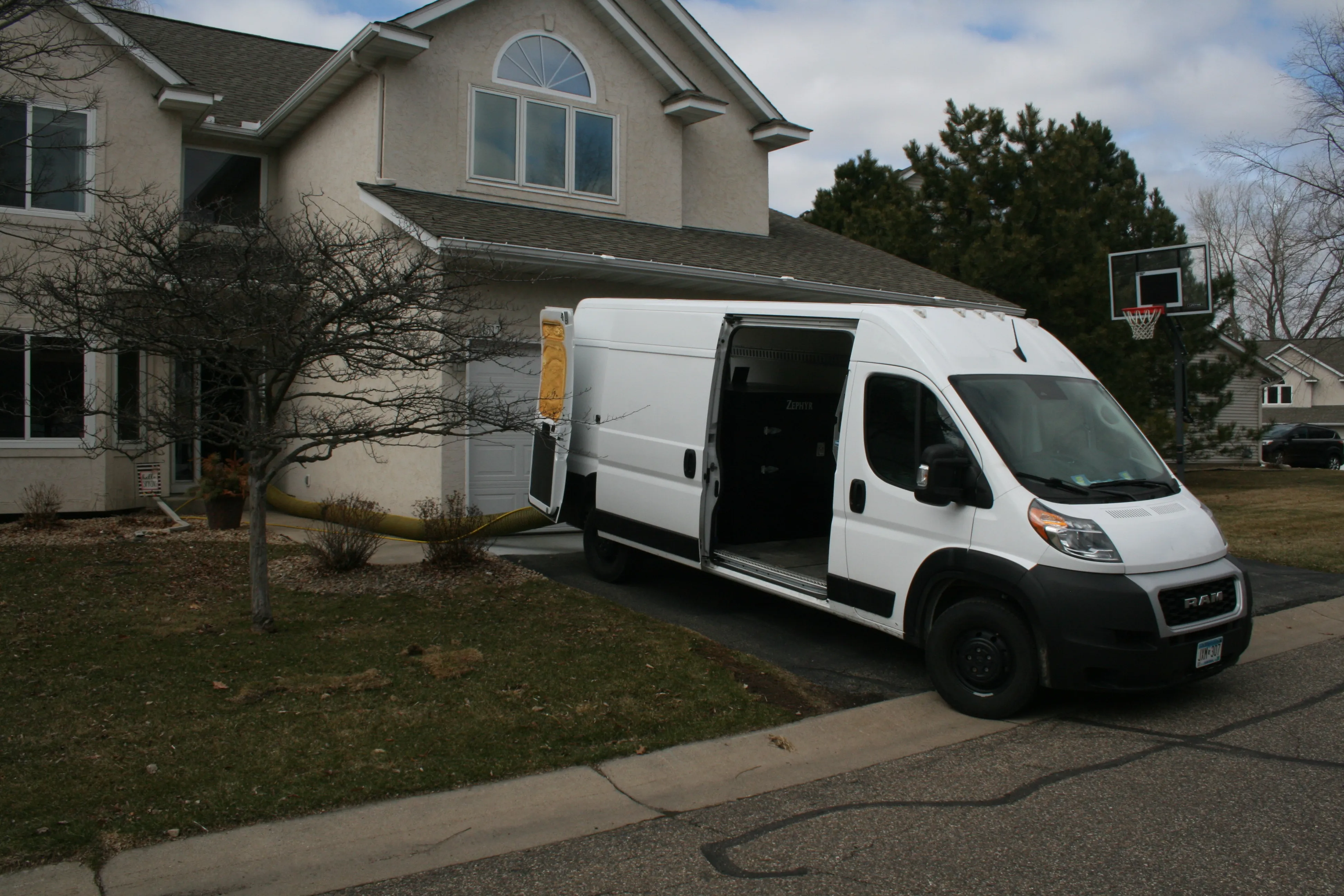 An AB CAM Services van on a residential job in the East Metro